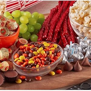 Buffet of Reese's Miniatures cups, Reese's Pieces candy, Twizzlers candy and Hershey's Kisses candy
